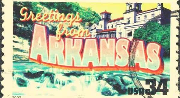 A photo saying Welcome to Arkansas on a stamp.