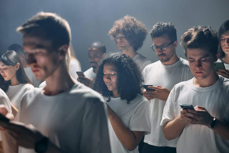 Image of people looking at phones used in my article, How To Understand the Landscape of Online Genealogy Records